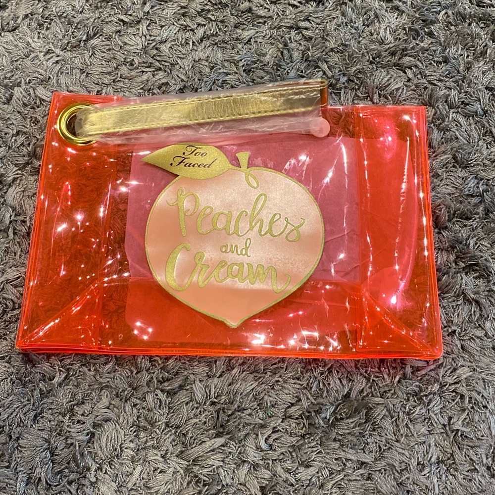 Too faced peaches and cream wristlet
